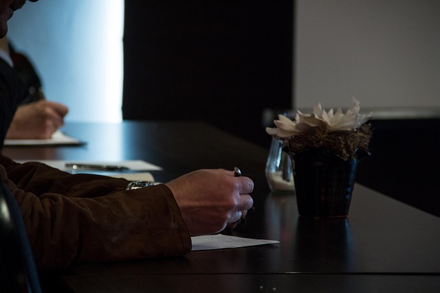 editorial desk with UK economic charts and notes